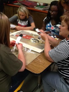 Mrs. Safley teaching a small group the fletching process.